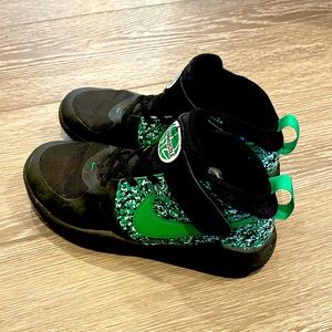 Nike size 2.5 basketball shoes.  Worn one indoor season and never worn outside.